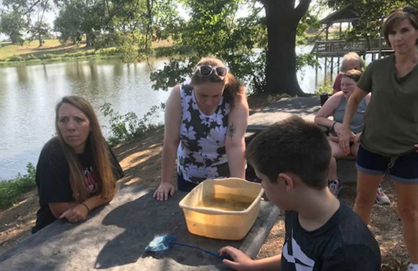 people studying water and plant samples